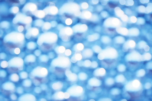 Awe beautiful christmaslight twinkly blue color dust glitz card copyspace area. Bright glittery de focus art soft sphere shape. Close-up view with space for text on dark cobalt merry xmas glowball scene - Photo, image
