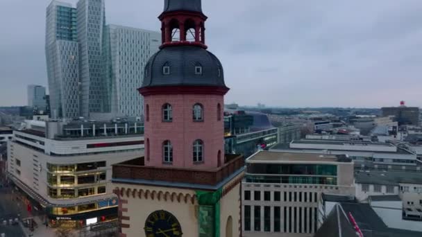 Fly around colour tower of St. Catherines Church. Modern buildings in city centre and Zeil shopping street in background. Frankfurt am Main, Germany. - Footage, Video
