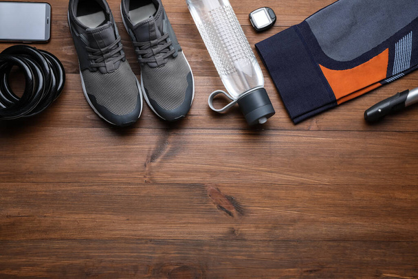Flat lay composition with different cycling accessories on wooden background, space for text - Valokuva, kuva