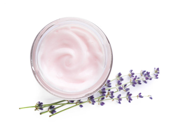 Jar of hand cream and lavender on white background, top view - Foto, Imagen