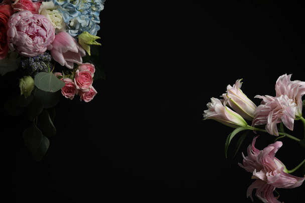 Beautiful fresh flowers on dark background, space for text - Valokuva, kuva