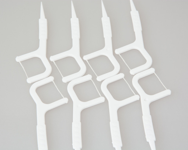Нові палички для зубної нитки
 - Фото, зображення