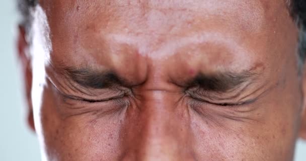 Person close-up eyes closed feeling upset feeling emocional, squinting eyesight - Footage, Video
