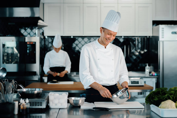 Professional restaurant kitchen: chefs prepare delicious dish - Fotoğraf, Görsel
