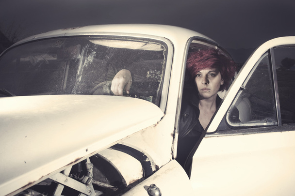 Woman inside an old car - Фото, зображення