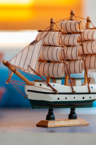 Close-up on a toy boat made of wood. Shallow depth of field - Photo, Image