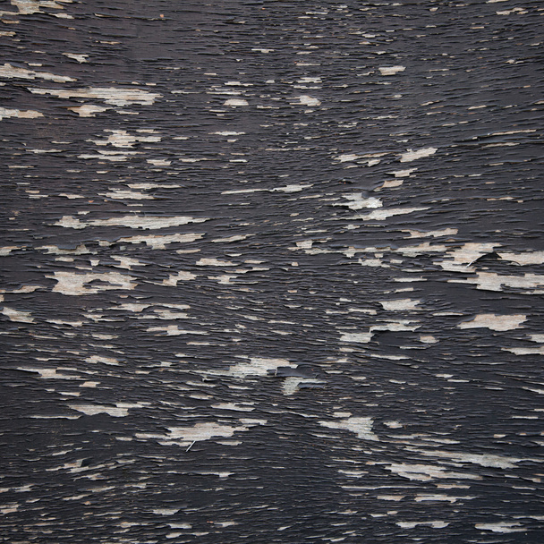 background consisting of wood with black peeling paint - Foto, imagen