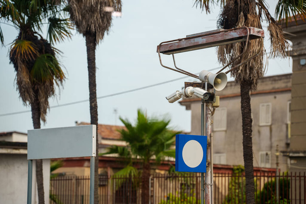 Surveillance camera and loudspeaker on the street. - 写真・画像