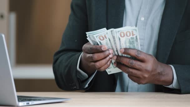 Close up African old male hands with money in office unrecognizable biracial success wealthy businessman holding dollars salary accounting savings budget cash financial income loan payment buying - Footage, Video
