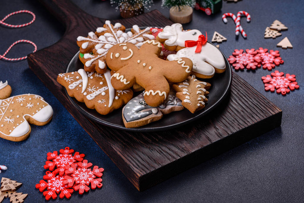 Christmas gingerbread. Delicious gingerbread cookies with honey, ginger and cinnamon. Winter composition - Photo, Image