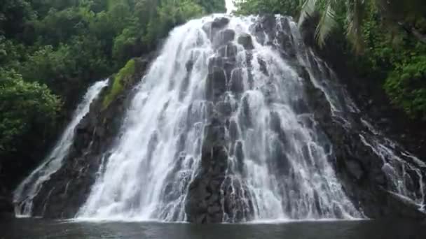 Kepirohi Waterfall inside the jungle in Pohnpei, Micronesia. Tropical exotic waterfall in wild nature of Micronesia. High quality 4k footage - Felvétel, videó