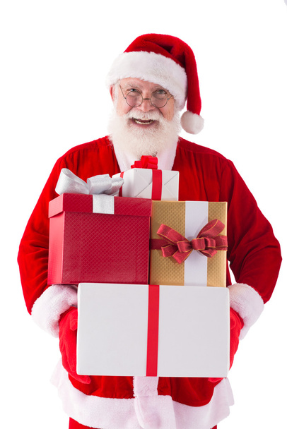 Santa segurando caixas de presente
 - Foto, Imagem