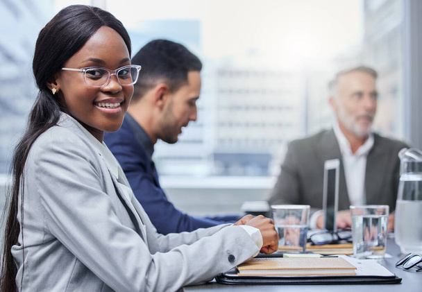 Were having some big discussions about success. Portrait of a young businesswoman having a meeting with her colleagues in a boardroom - Foto, immagini