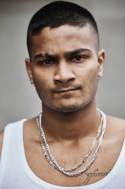 Street life. Cropped portrait of a handsome young male gangster standing outside on the street - 写真・画像