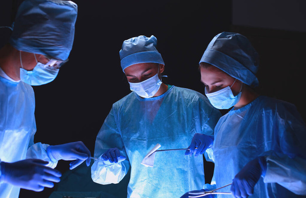 Team surgeon at work in operating. Hospital. - Фото, изображение