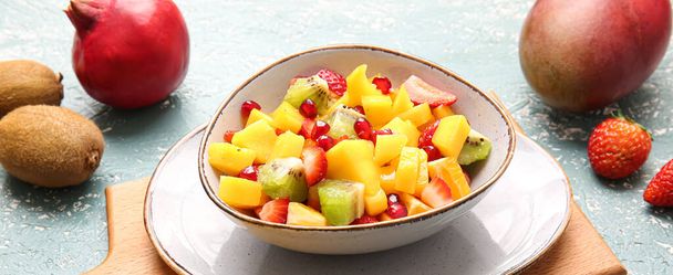 Bowl with sweet fruit salad on table - Photo, Image