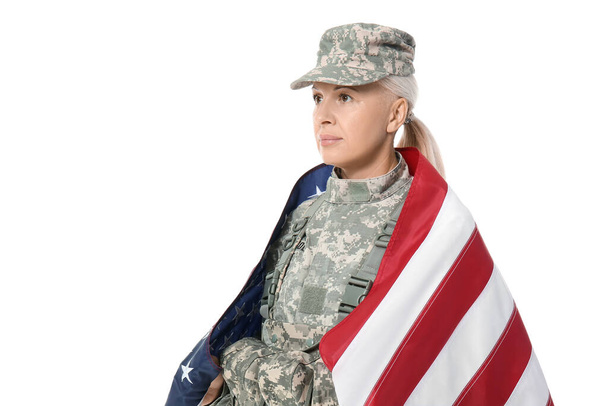 Mature female soldier with USA flag on white background - Foto, Imagen