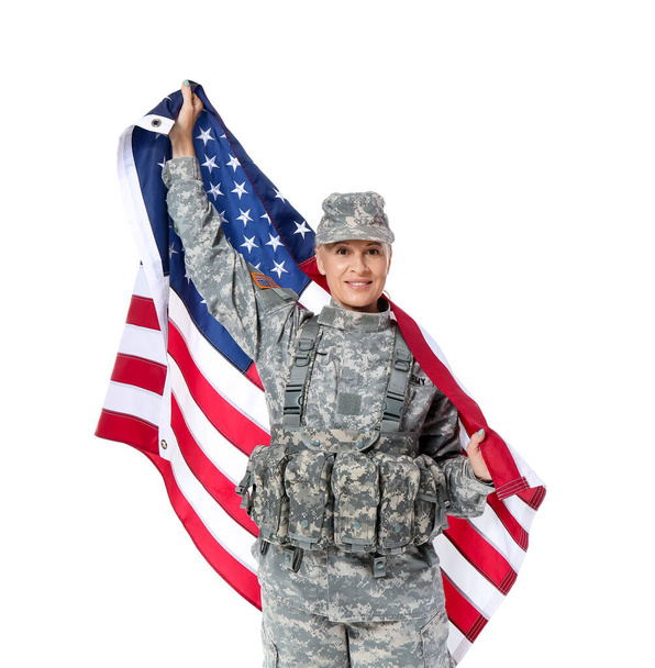 Mature female soldier with USA flag on white background - Фото, изображение