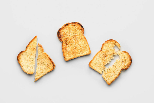 Crispy toasts on light background - Zdjęcie, obraz