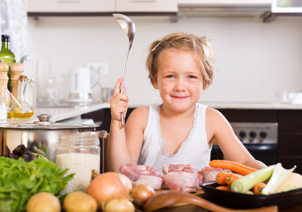 Baby girl cooking with meat - Photo, Image