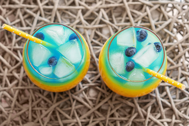 Blue and yellow cocktails like the flag of Ukraine. Two patriotic cocktails, victory concept. Top view - Zdjęcie, obraz