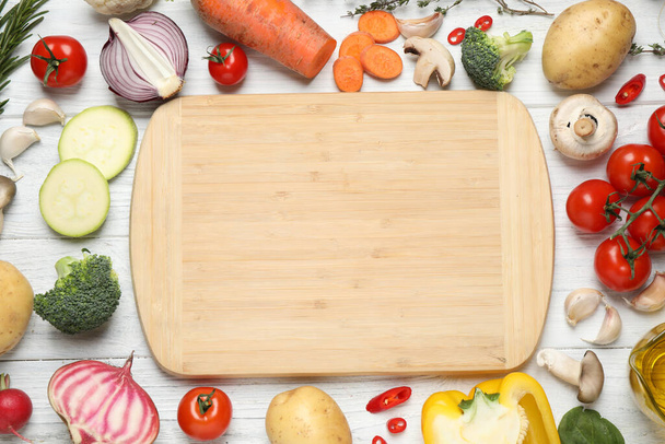 Flat lay composition with fresh products on white wooden table, space for text. Healthy cooking - Foto, Imagen