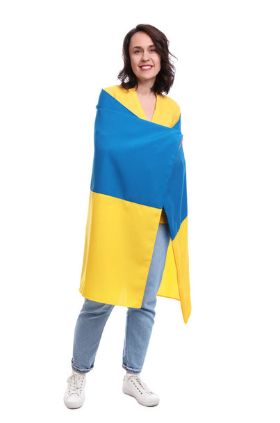 Happy woman with flag of Ukraine on white background - Foto, imagen