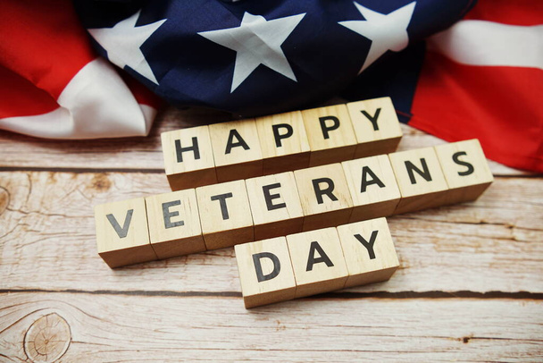 Happy Veterans Day alphabet letter and American flag on wooden background - Photo, Image
