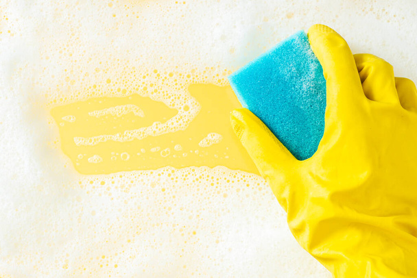 Cleaning concept - foam frame and cleaning sponge on bright background. High quality photo - Zdjęcie, obraz
