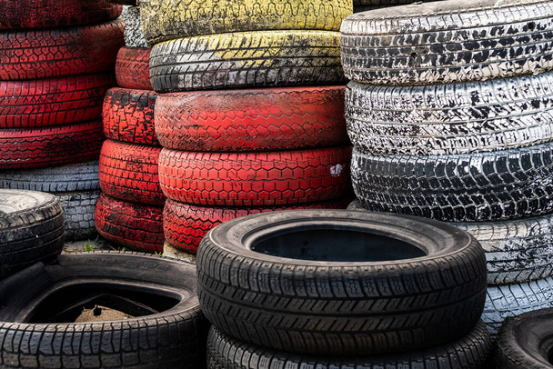 Pile Of Old Used Car And Bike Tyres Representing Hazardous Waste And Material For Recycling Rubber  - Fotografie, Obrázek