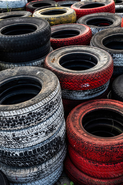 Pile Of Old Used Car And Bike Tyres Representing Hazardous Waste And Material For Recycling Rubber  - Foto, afbeelding