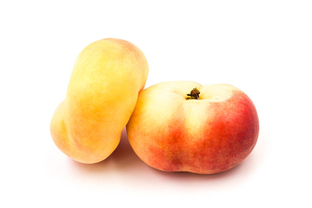 Two ripe fresh organic fig peaches isolated on white background. - Zdjęcie, obraz
