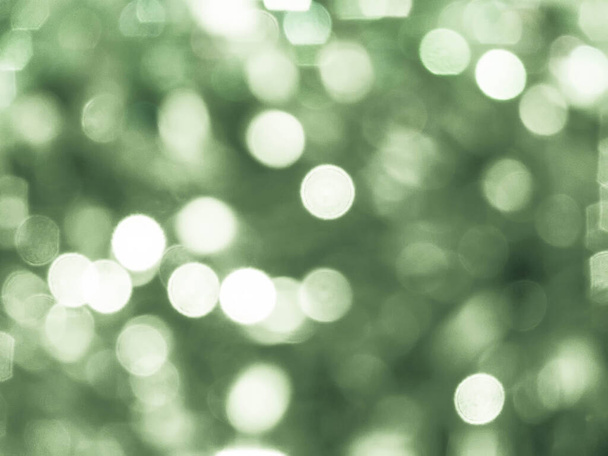 Green background with abstract spots of light, photo toned, bokeh - Foto, afbeelding