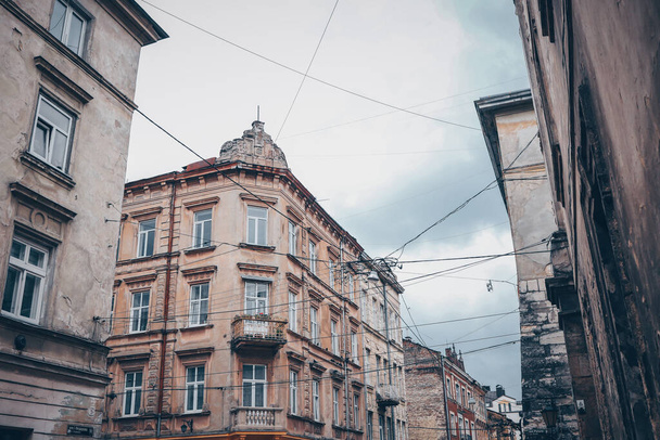 Facades of houses in Lviv, old buildings against the sky - Фото, изображение