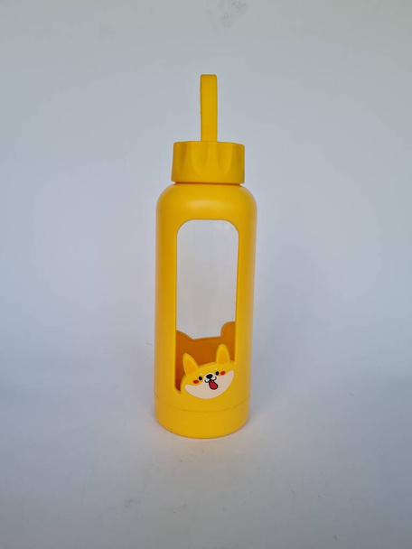 Yellow drink holder on a white background - Valokuva, kuva