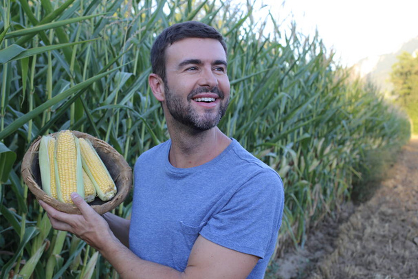 close-up portrait of handsome young man in corn field - Foto, Imagem