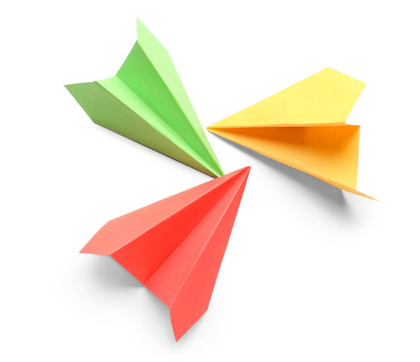 Colorful paper planes on white background - Foto, imagen