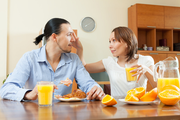 Happy man and woman having breakfast   - Фото, зображення