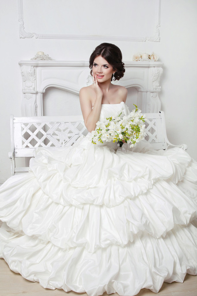 Beautiful attractive bride in wedding luxurious dress with volum - Фото, изображение