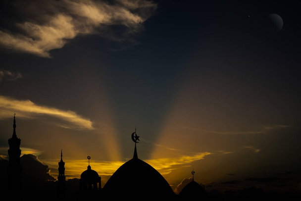 Ramadan, Eid ai-fitr,New year Muharram islamic religion Symbols with Mosques Dome silhouette with Crescent moon on dark black and twilight sky in night sunset. arabic,Eid al-adha,mubarak  Muslim. - Fotó, kép