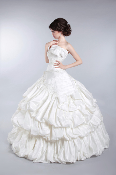 Beautiful attractive bride model wearing in wedding dress with v - Фото, изображение