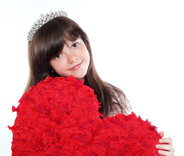 Pretty teen girl holding big red hear isolated on white backgrou - Zdjęcie, obraz