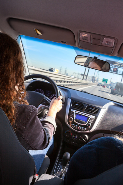 Woman driving vehicle on highway - Foto, imagen