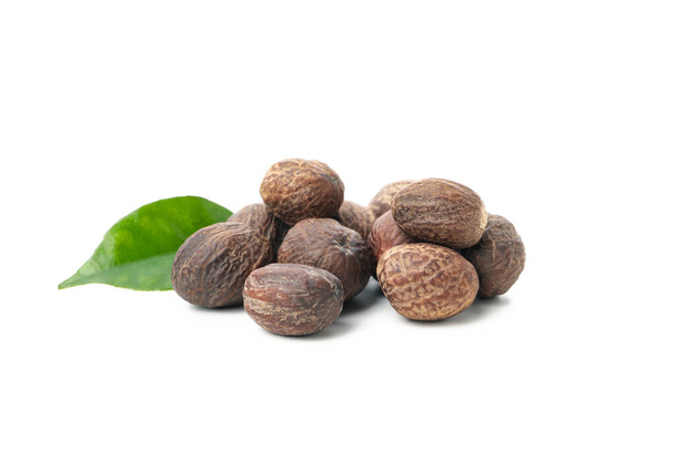 Nutmegs and leaf isolated on white background - Photo, image