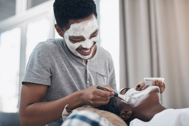 Quarantine dates take a bit of creativity. a young couple getting homemade facials together at home - Photo, Image