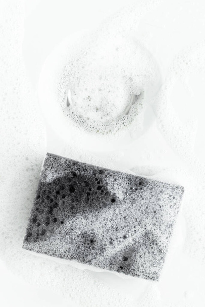Sponge for washing with foam in the bath. - Φωτογραφία, εικόνα