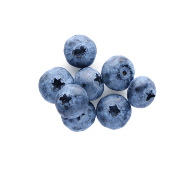 Pile of tasty fresh ripe blueberries on white background, top view - Photo, image