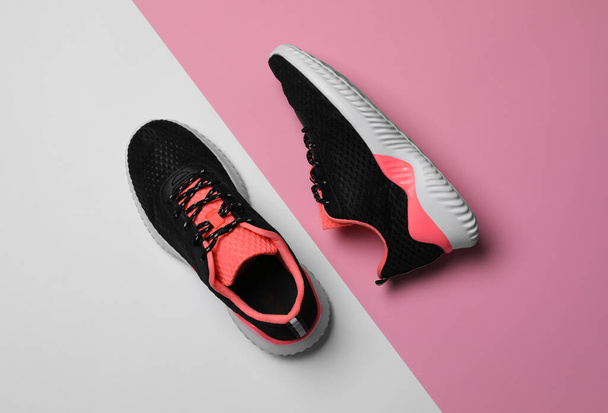 Pair of stylish sport shoes on color background, flat lay - Fotoğraf, Görsel