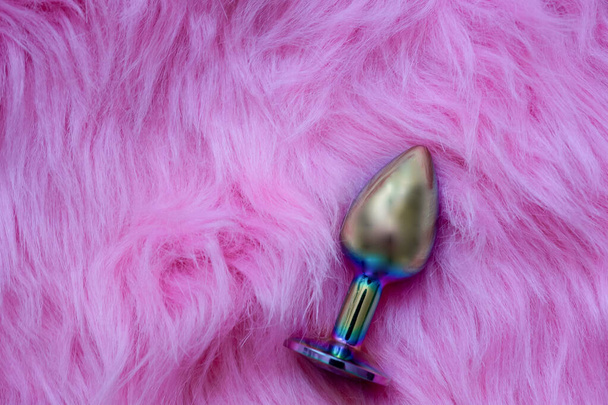 anal butt plug sex toy on fur pink background, sex shop advertisement - Fotografie, Obrázek