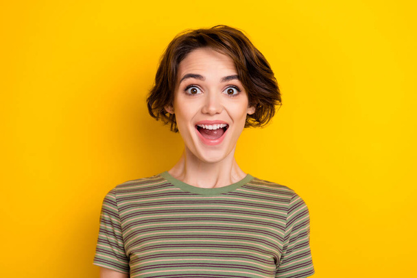 Closeup photo of excited shocked lady looking directly camera low price shopping yeah isolated on yellow color background. - Фото, зображення